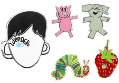 Five book themed enamel pins.