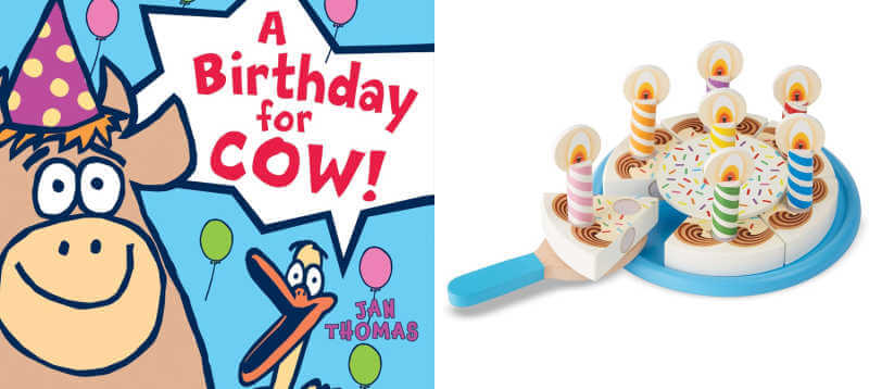 A Birthday for Cow book next to toy wooden birthday cake.