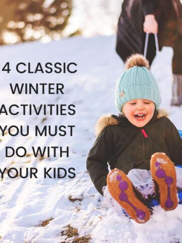 Smiling child on sled in snow with text overlay that reads, 14 classic winter activities you must do with your kids.