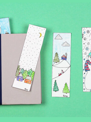 Four winter themed bookmarks and a book.