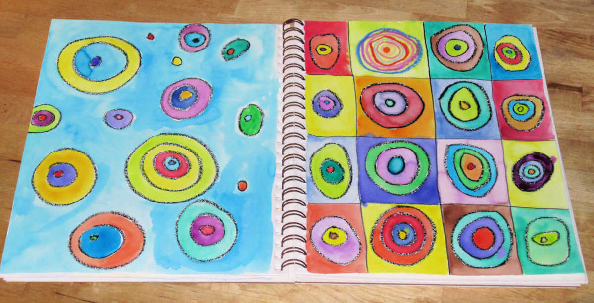 Open art journal featuring colorful circle art.