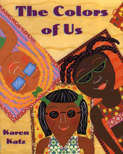 Book cover of The Colors of Us with illustration of three smiling people lying on beach blankets.