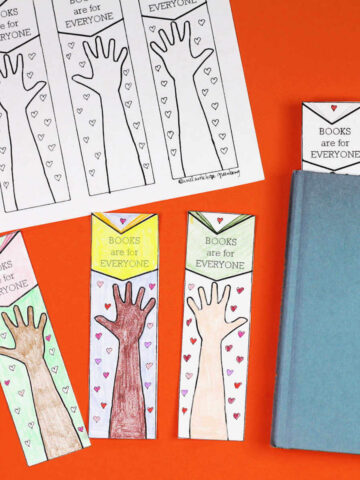 Sheet 4 printable bookmarks with illustration of hand reaching for an open book with text "Books are for Everyone" surrounded by tiny hearts plus cut out and colored in bookmarks next to a book.