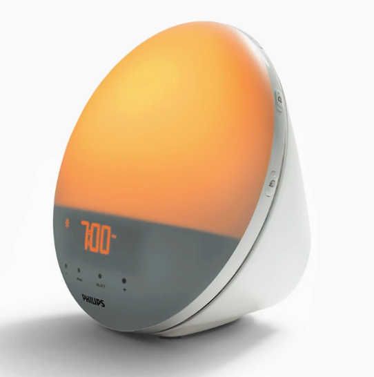 Round, sunrise lamp, glowing orange.