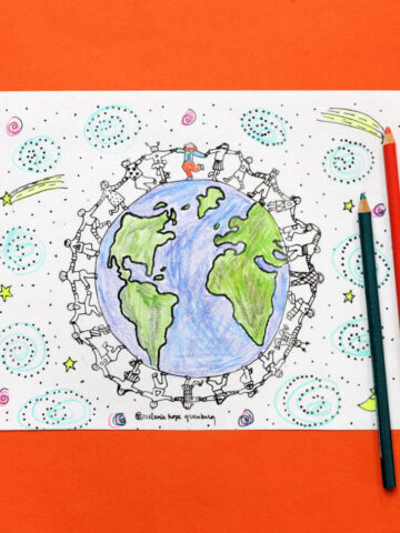Coloring page of children holding hands in circle around the globe against a backdrop of stars and swirls, next to several colored pencils.